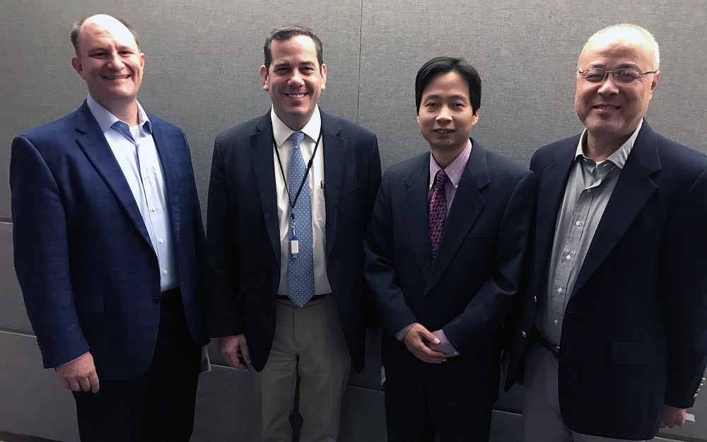 From Left to Right: Co-organizer David Plas, PhD, associate professor in the Department of Cancer Biology; Keynote Speaker Jason Chesney, MD, PhD, director of the James Graham Brown Cancer Center at the University of Louisville;  Co-organizer Xiaoting Zhang, PhD, associate professor in the Department of Cancer Biology; and Co-organizer Xiaoyang Qi, PhD, professor in the Division of Hematology Oncology.