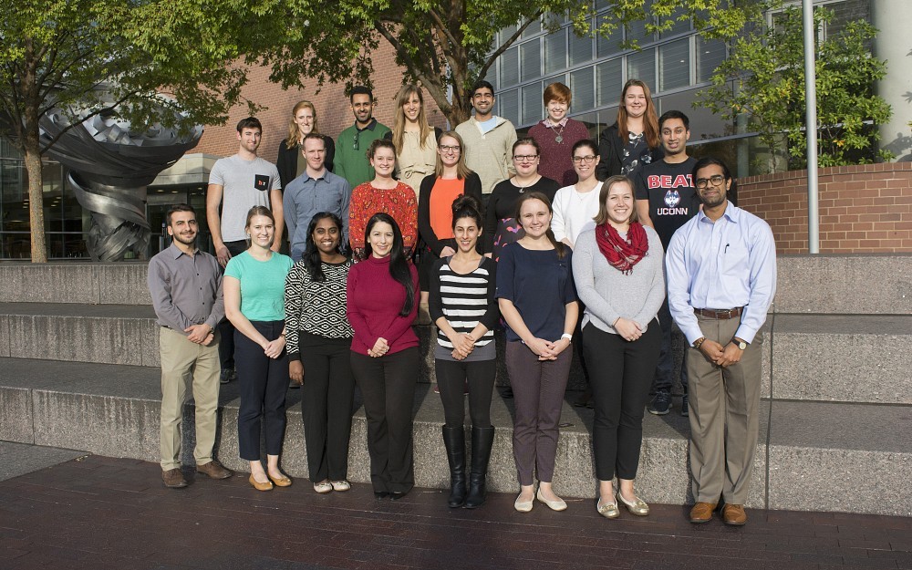 UC students helping to create a health clinic for undocumented residents pose for a picture outside of the College of Medicine.