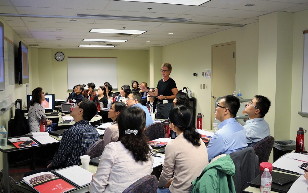 Carolyn Stoll, an instructional designer in the Center for Educational Technology and Instructional Support in CAHS, with faculty from Shandong University in China. 