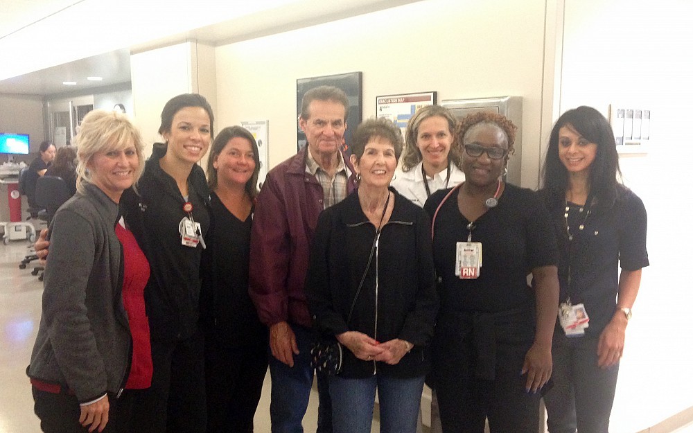 Rodney and Judy Hastings ( center) returned to visit the UC Health team that took care of Judy for nine weeks in the NSICU. From left: Tina Horsely, Kara Bengal, Chris Henderson, Rodney and Judy Hastings, Simona Ferioli, MD, Lynette Washington and Erika Schlichter.