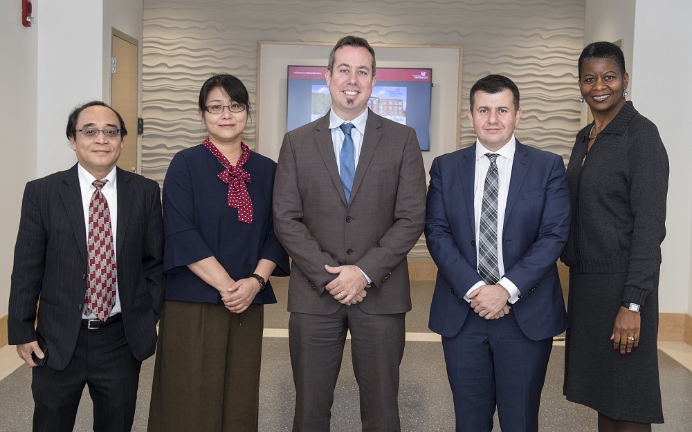 Left to Right: Associate professor Alex Lin, PhD, Tomoko Yamado-Inagawa, PhD, Dean Neil Mackinnon, PhD, Daniel Salcedo, MD and Pat Achoe, RpH
