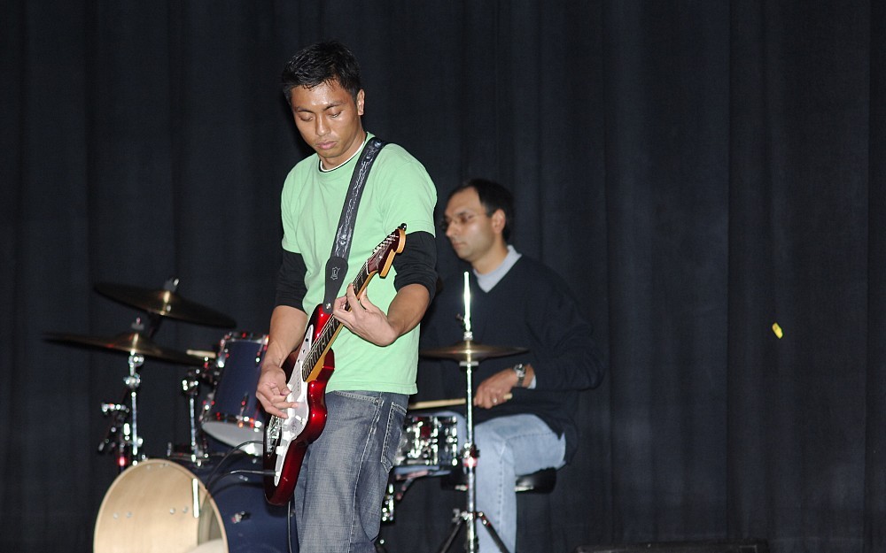 
Medical Student Arvin Ejaz plays the guitar as part of the band Kocher Maneuver, a highlight of a previous IvaDean Scholarship Benefit Concert. 