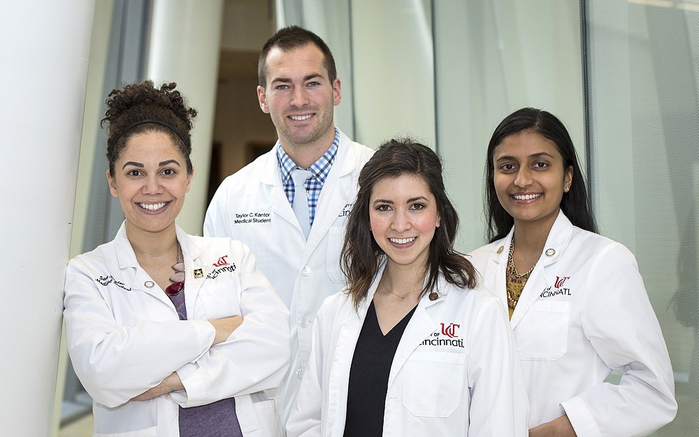 Fourth-year medical students Sara Stigler, Taylor Kantor (rear), Christine Rubeiz and Nisha Giridharan are shown in CARE/Crawley Atrium.