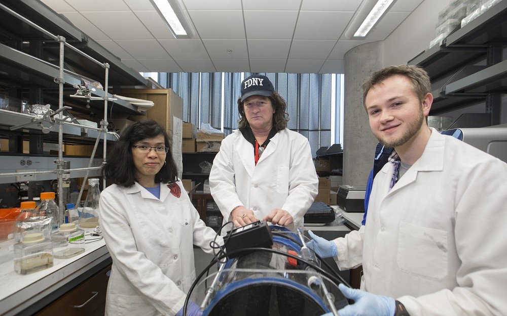 Daniel Hassett, PhD, (center) is shown with Warunya Panmanee, PhD, research associate, (left) and Cameron McDaniel, PhD student (right) in a laboratory in the UC College of Medicine.