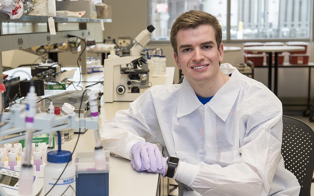 Andrew (Scottie) Emmert is shown in a laboratory in the UC College of Medicine.