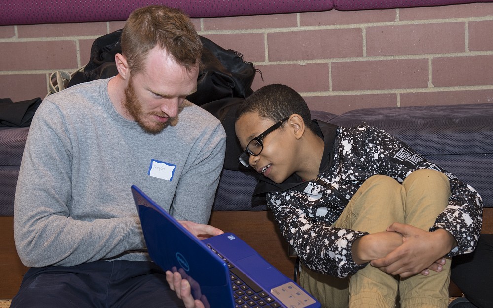 
Kevin McDonald, a second-year medical student, is shown with his mentee, Derrick Carter, a fifth-grader at South Avondale School, trying out a new laptop.
