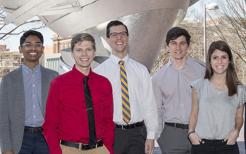 Shown in front of CARE/Crawley Building are Bhargav Vemuri, Justin Smith, Austin Songer, John Bonamer and Anna Hopkins.
