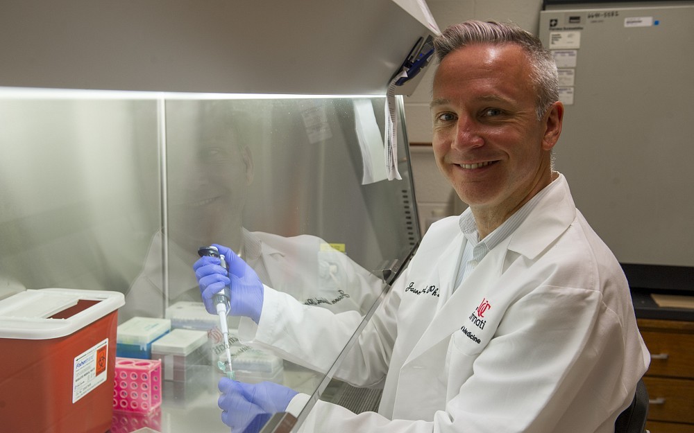 Jason Blackard, PhD, associate professor in the Division of Digestive Diseases, is shown in a UC College of Medicine laboratory.