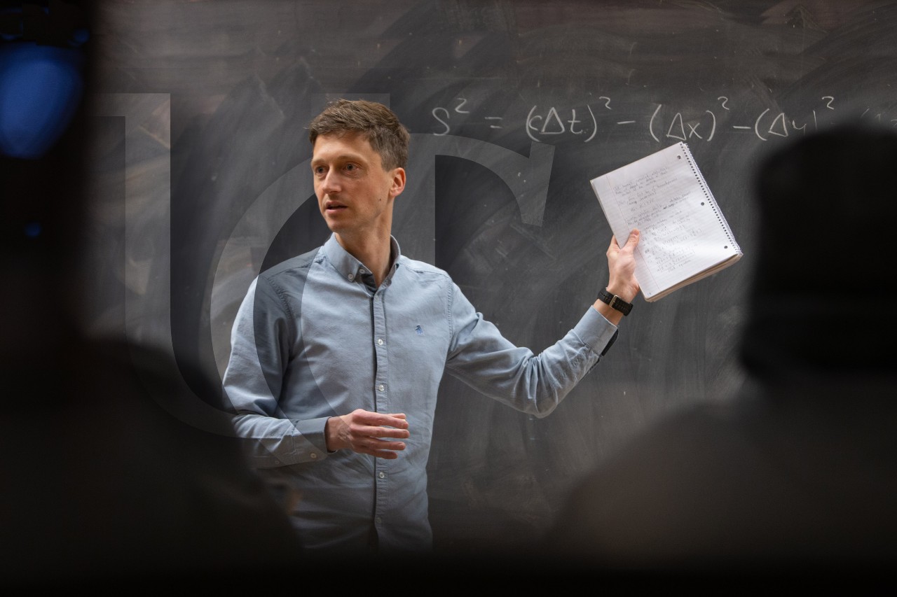 A UC professor speaks to a class