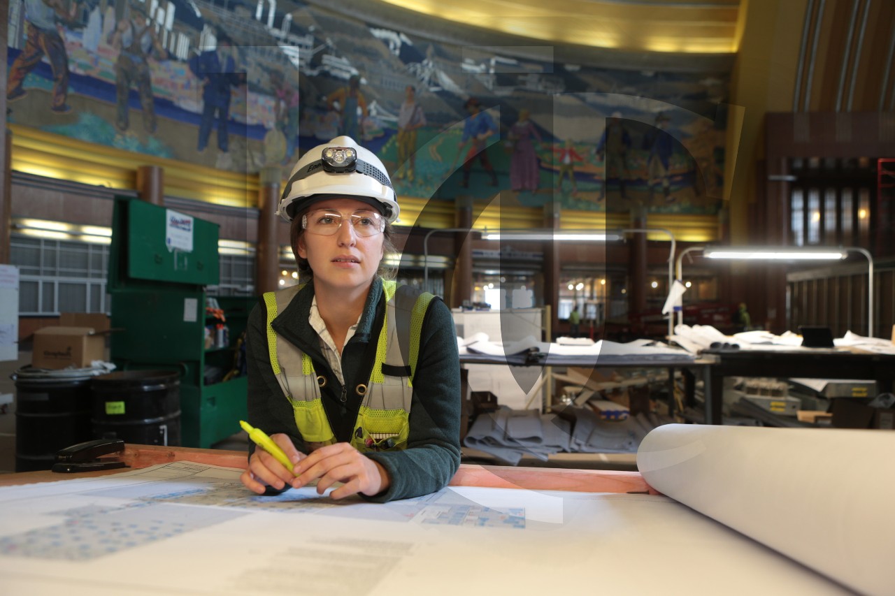 A UC co-op student looks at blueprints at Cincinnati's Union Terminal