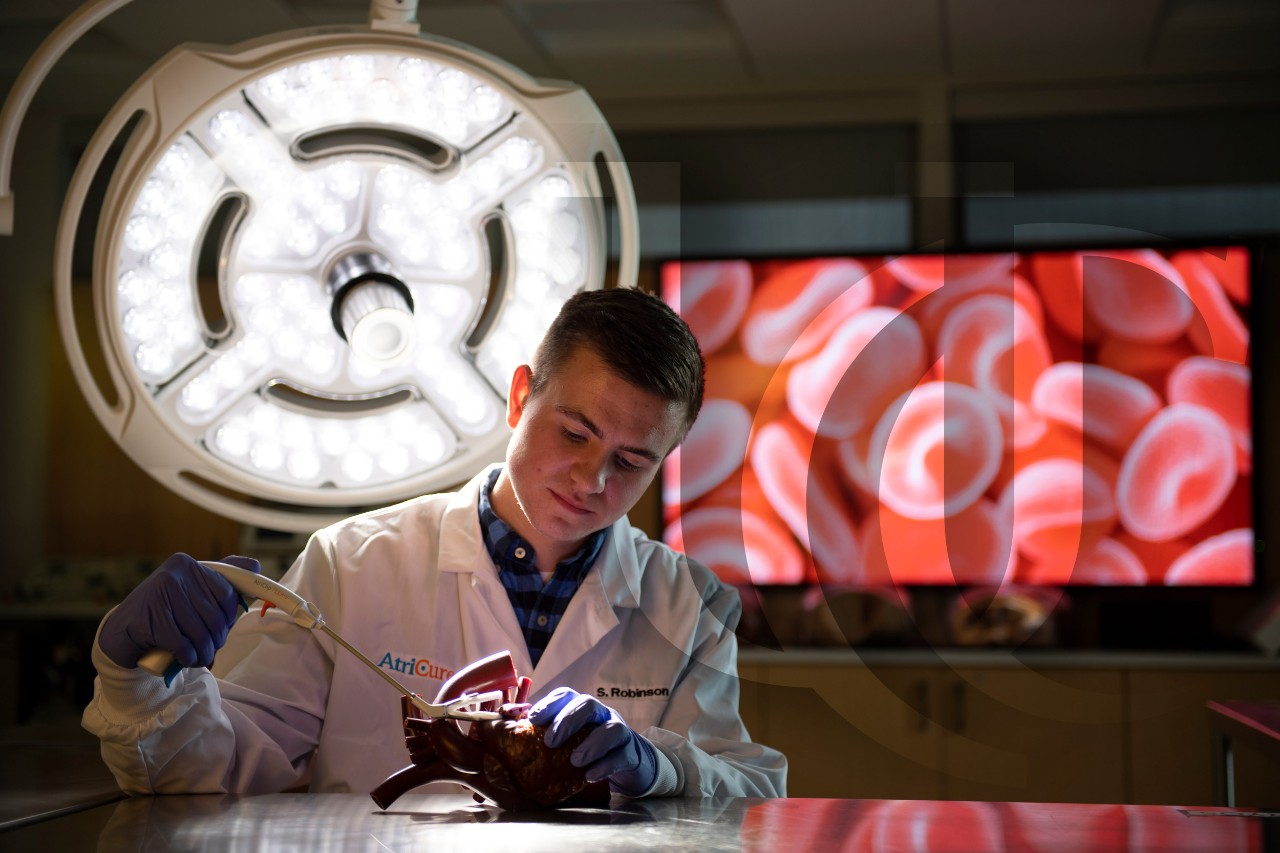 A UC student works in a medical lab