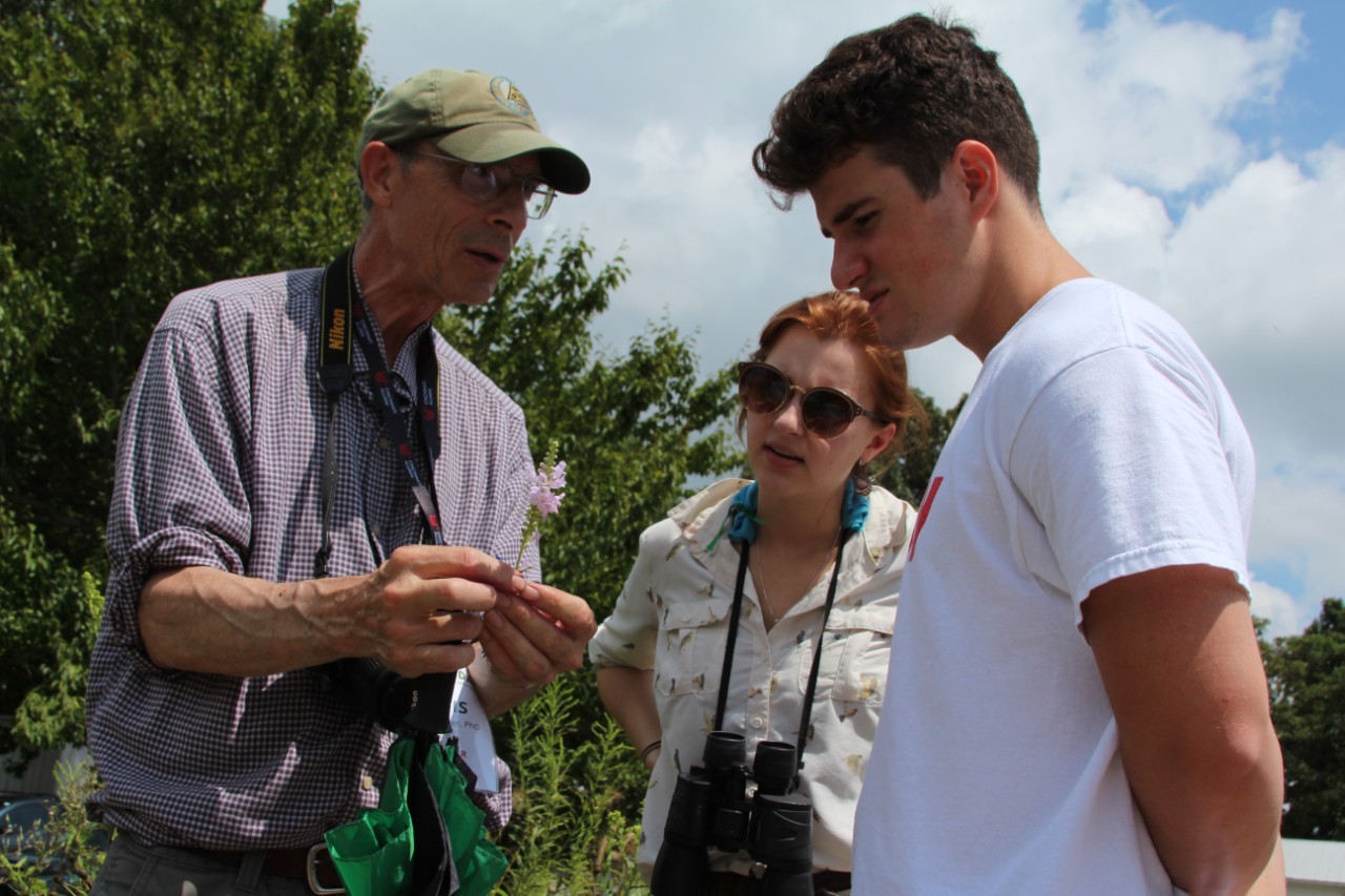 Professor Dennis Conover guiding Science day participants on a plant walk