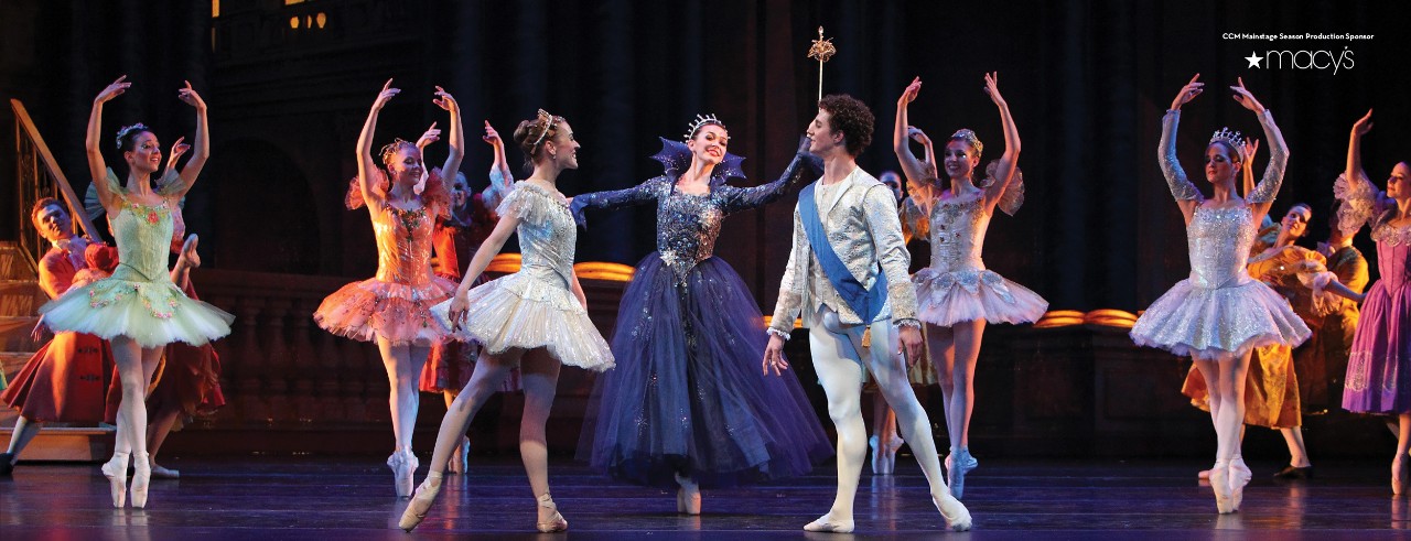 Cinderella and Prince Charming dancing with the Fairy Godmother.
