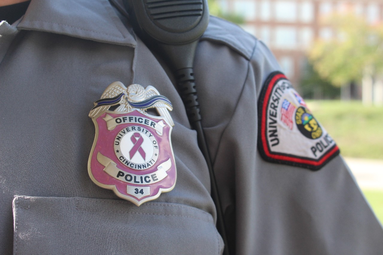 A UCPD officer wears the new, pink badge the department purchased for Breast Cancer Awareness Month.