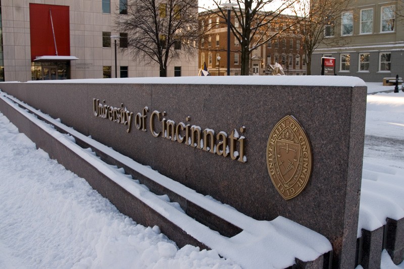 snow along the main campus name  sign near University Pavilion