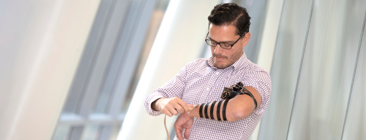 Jack Rubinstein, MD, offers a layman's demonstration of tefillin.
