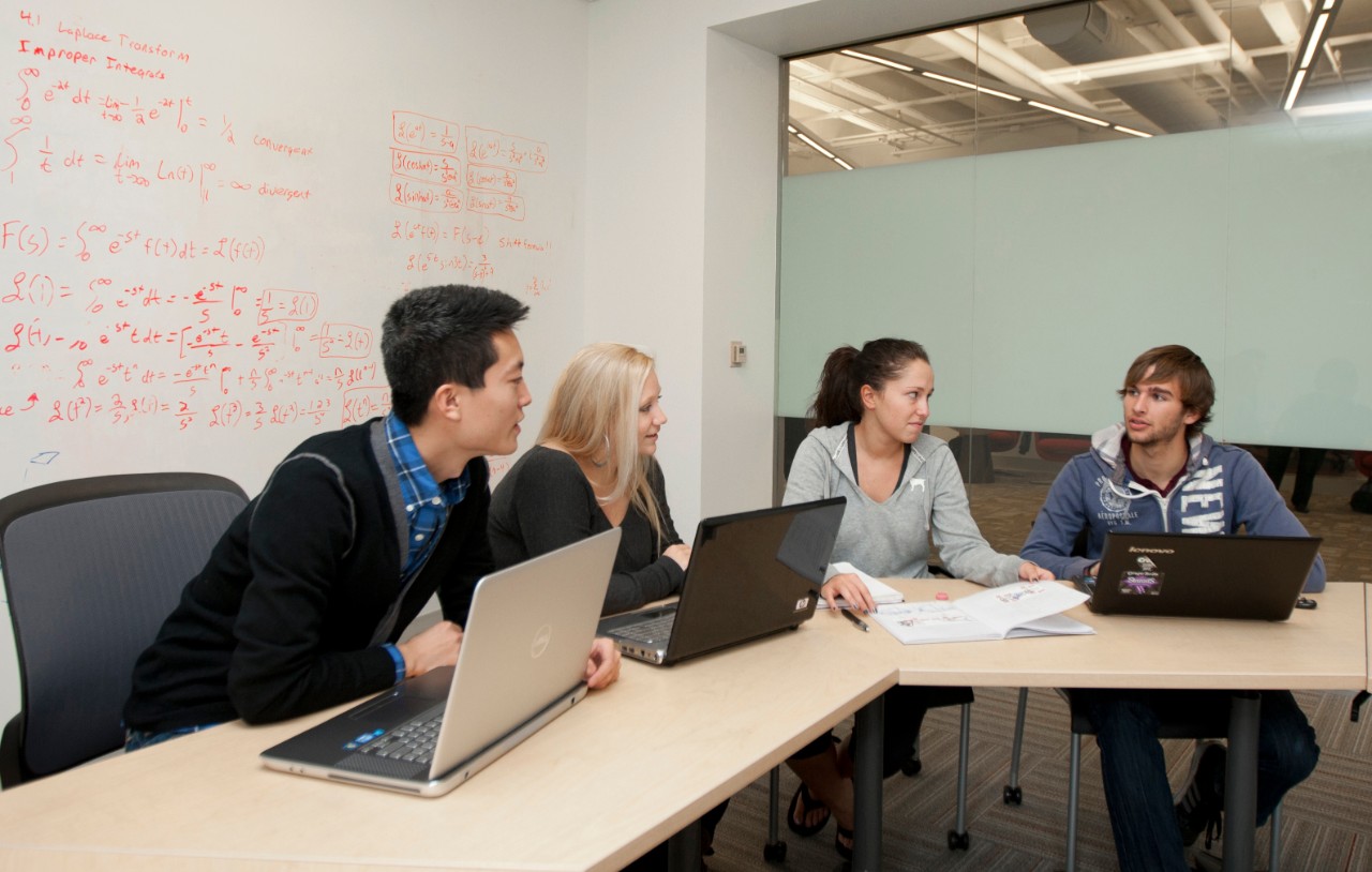 students at table working together on a group project