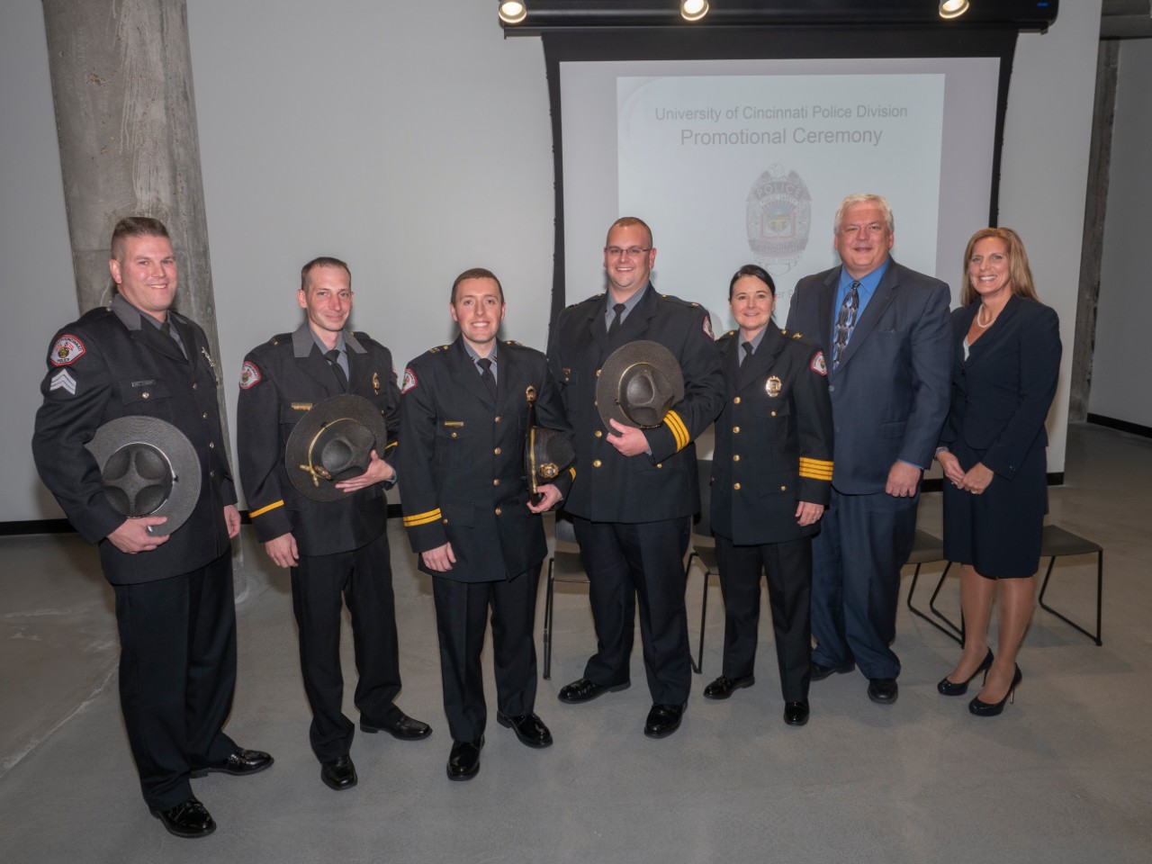 Vice President of Safety and Reform Robin Engel, Director of Public Safety James Whalen and UC Police Chief Maris Herold stand with the four newly promoted officer during a ceremony on Nov. 9.