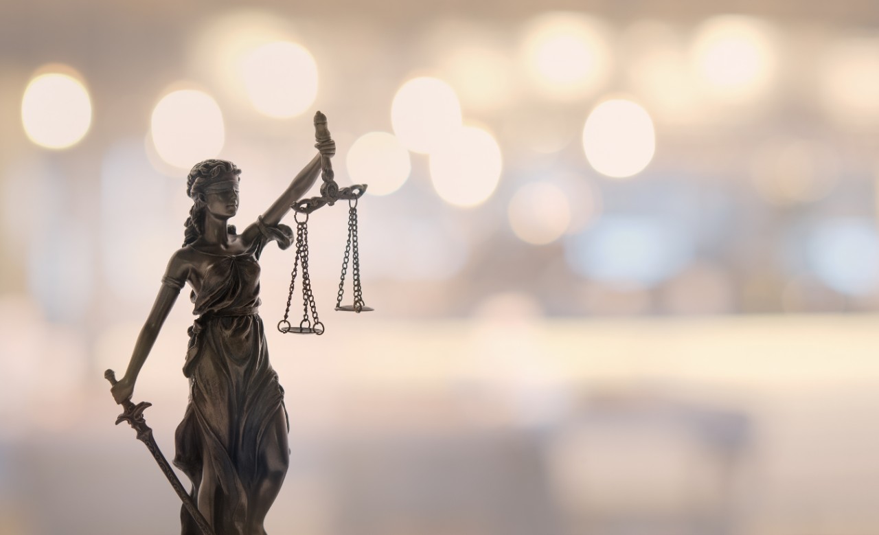 Justice law legal concept. statue of justice or lady justice with bokeh background.