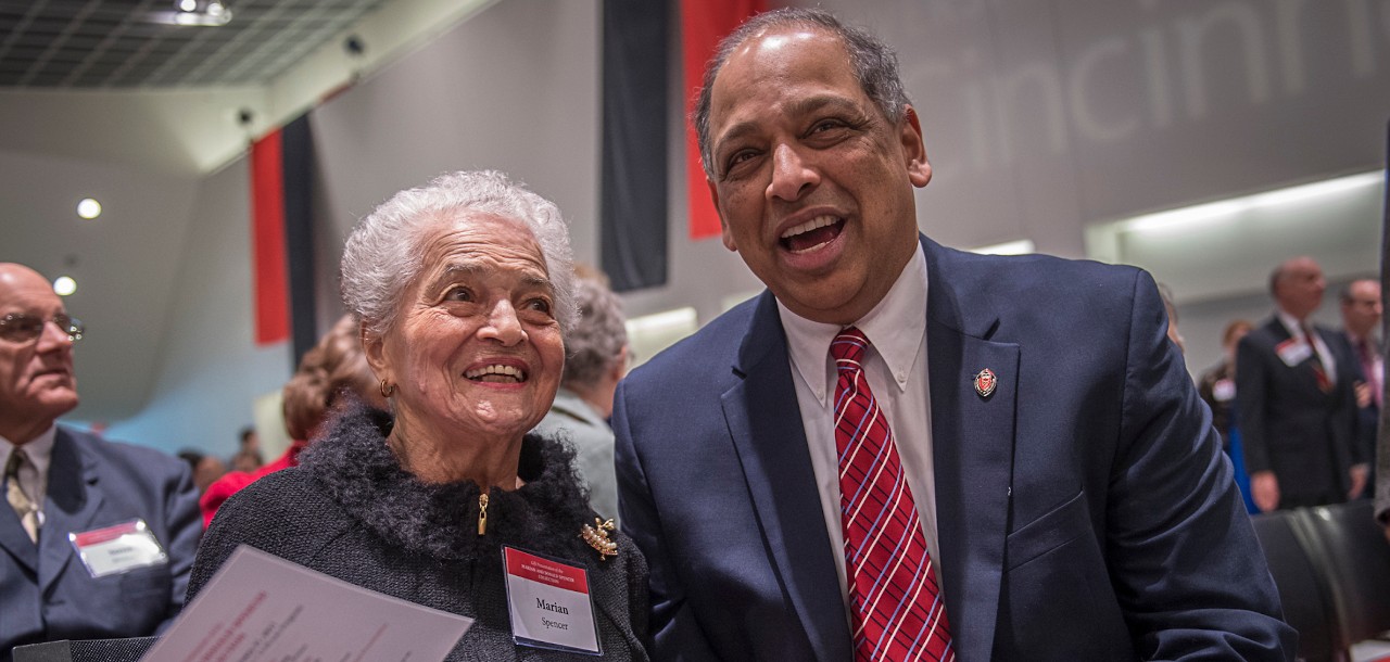 Marian Spencer and Presidet Neville Pinto talk during an event at the University of Cincinnati