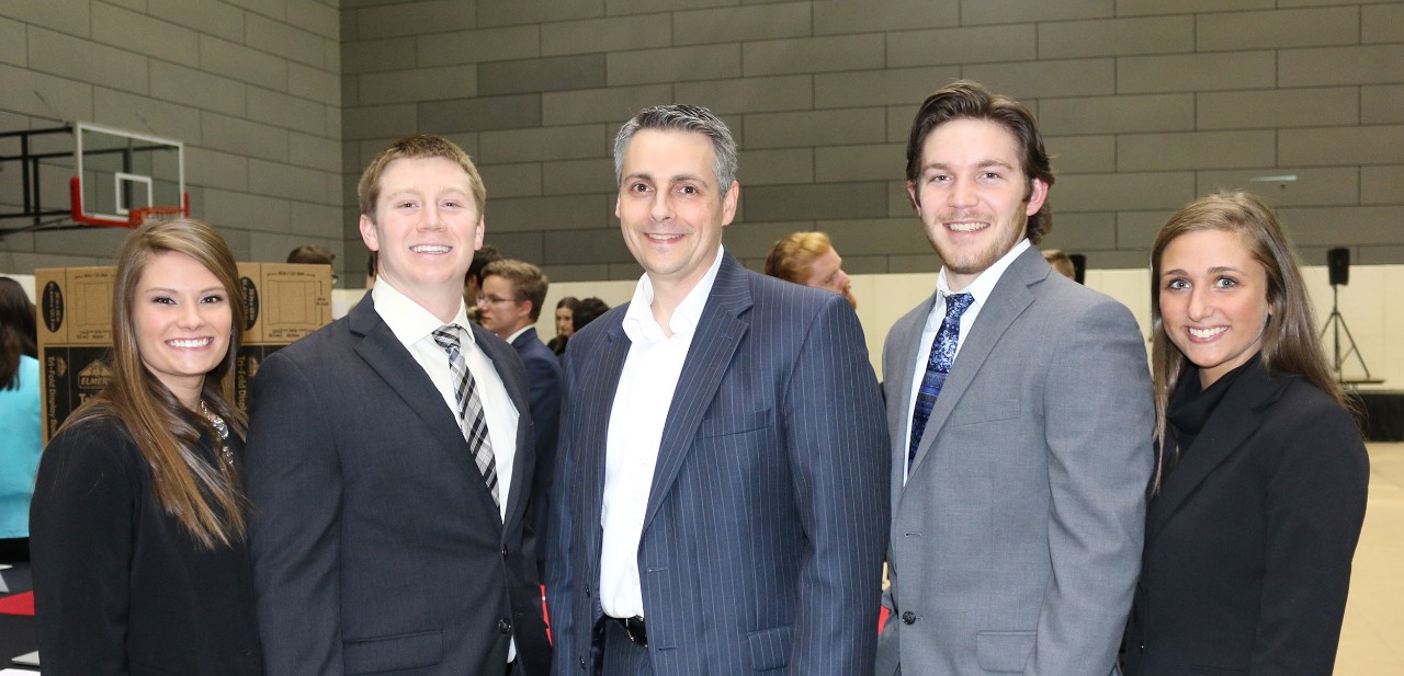Thomas Dalziel, PhD (center) poses with student entrepreneurs at an IQ E-Pitch event