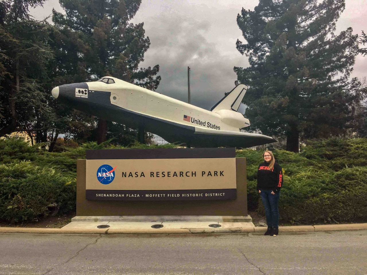 Lanzillotta stands next to NASA sign