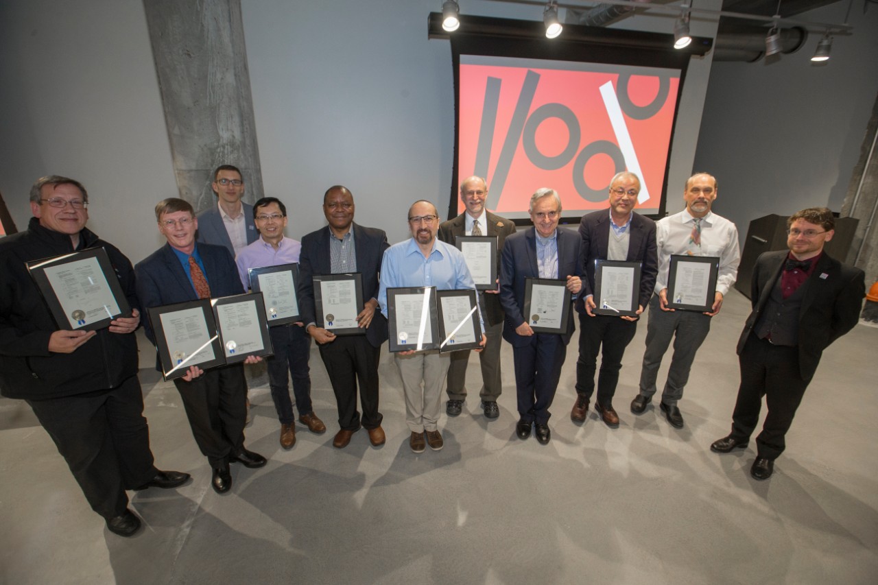 Ten UC faculty members display their U.S. patent certificates.