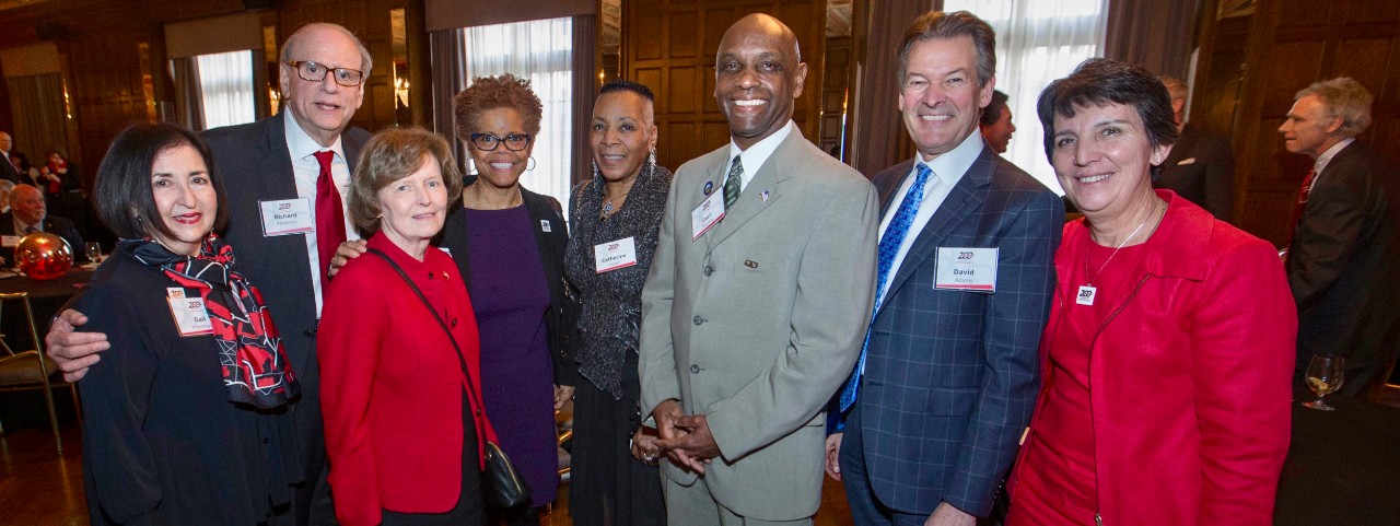 Left to right Gail and Richard Friedman, UC Trustee Margaret K. “Peg” Valentine, College of Law Dean Verna Williams,  Ohio State Rep. Catherine Ingram, Ohio state Sen. Cecil Thomas,  UC Chief Innovation Officer David Adams and Bicentennial co-chair Kim Dobbs, pose with with the UC 200 Bicentennial sign during the Bicentennial Commendation & Reception at the Athletic Club in Columbus, Ohio.