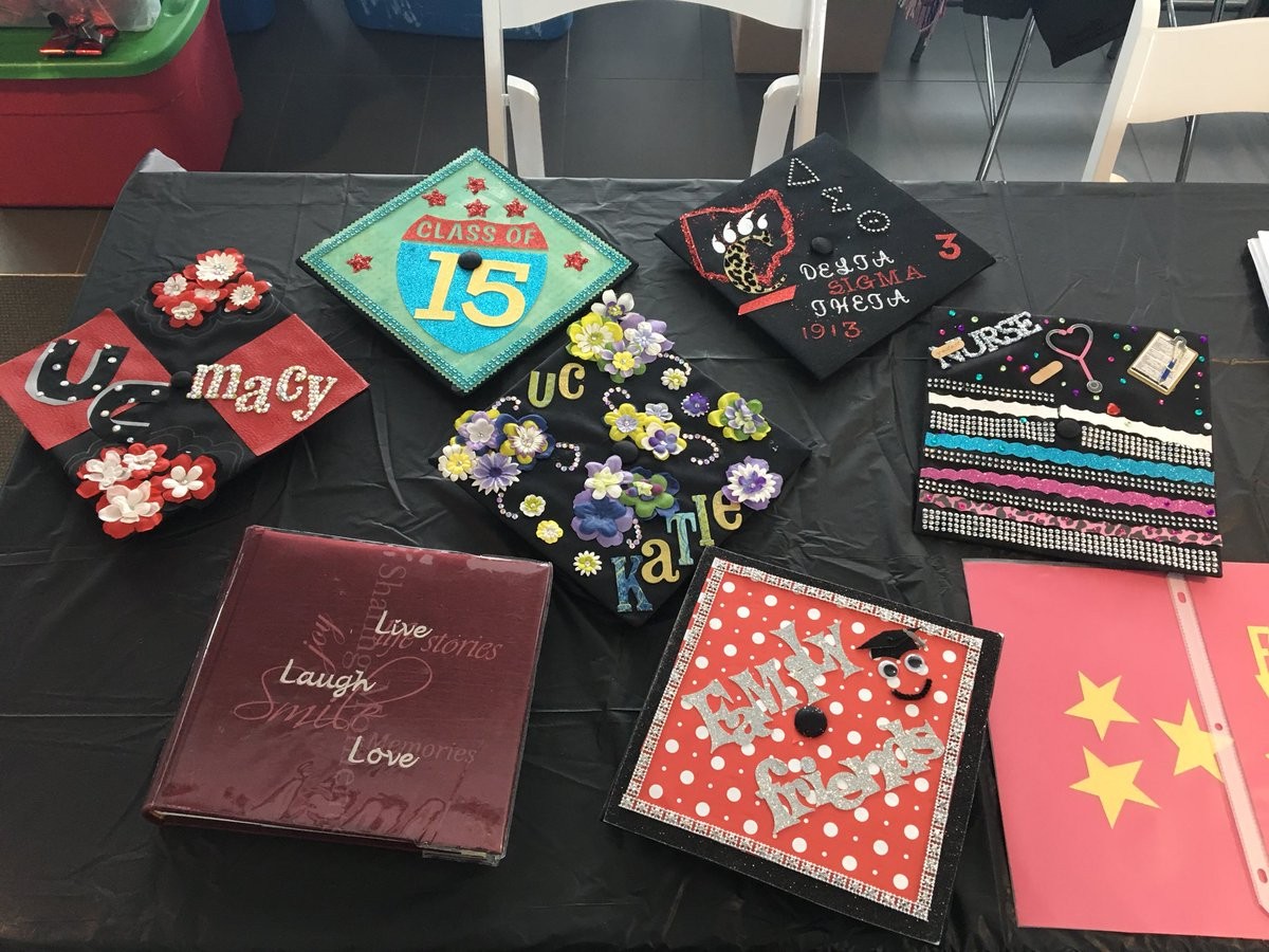Graduation caps decorated with letters and glitter