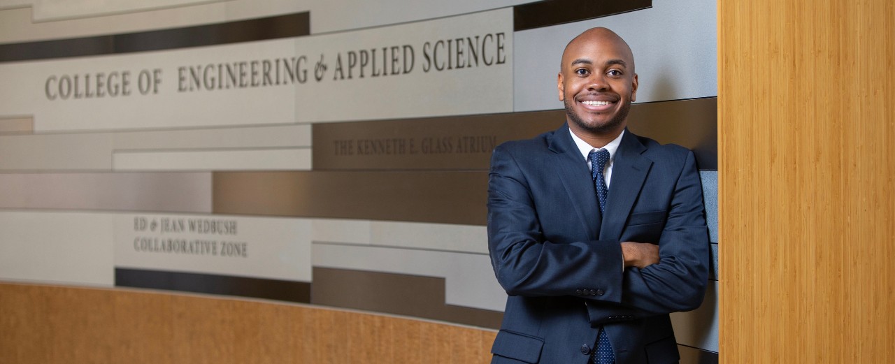 UC engineering student Rickey Terrell stands  in the hall of UC's College of Engineering and Applied Science.