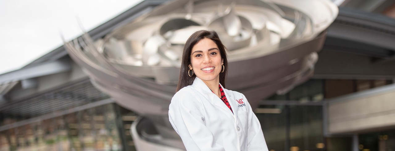 Courtney Giannini is shown in front of the UC College of Medicine.