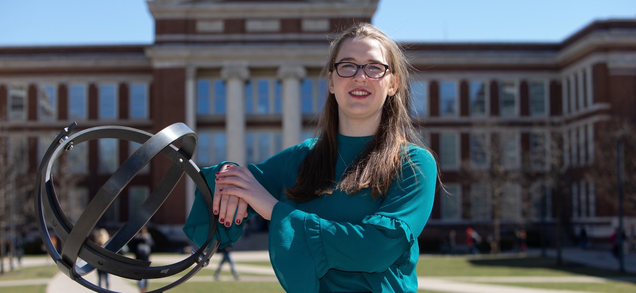 UC engineering student Laura Stegner stands in front of Baldwin Hall.