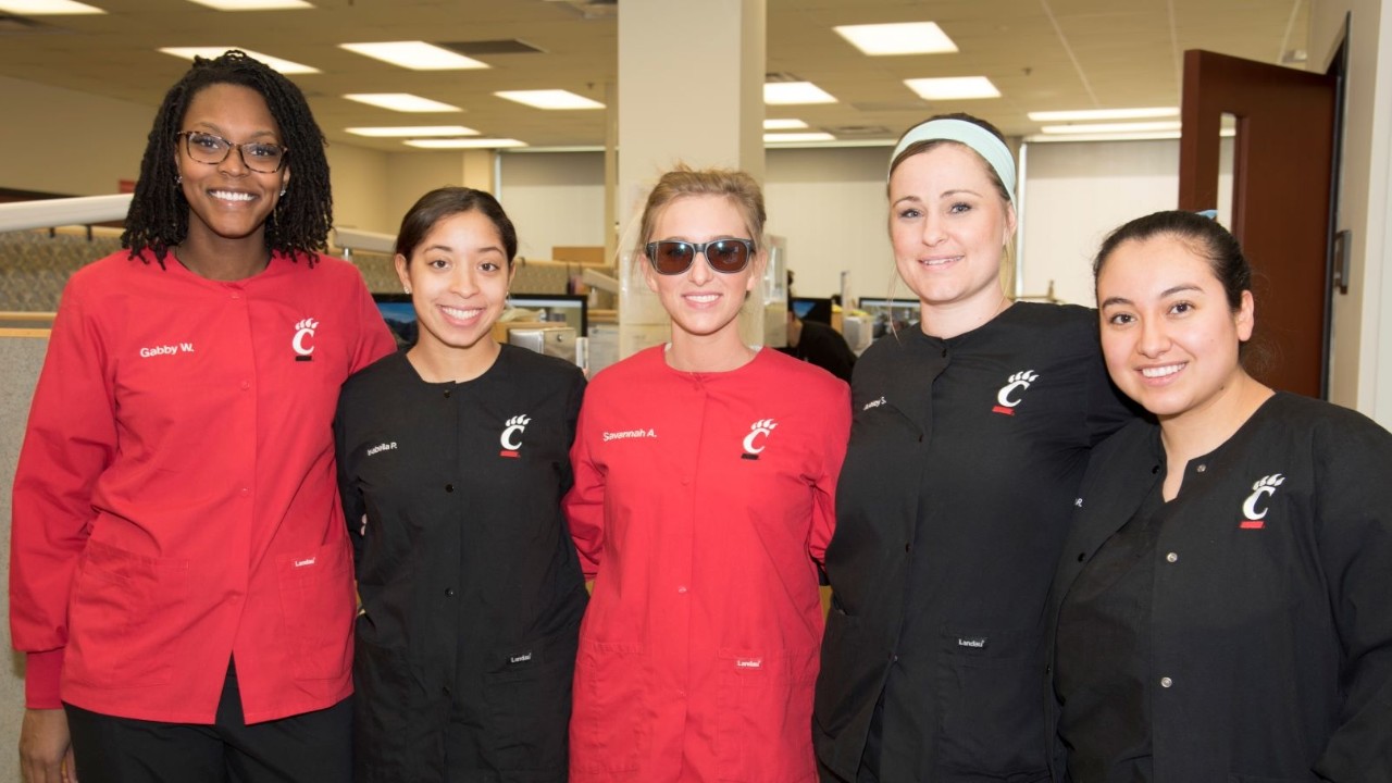 Savannah Allen with four fellow dental hygienists in the lab
