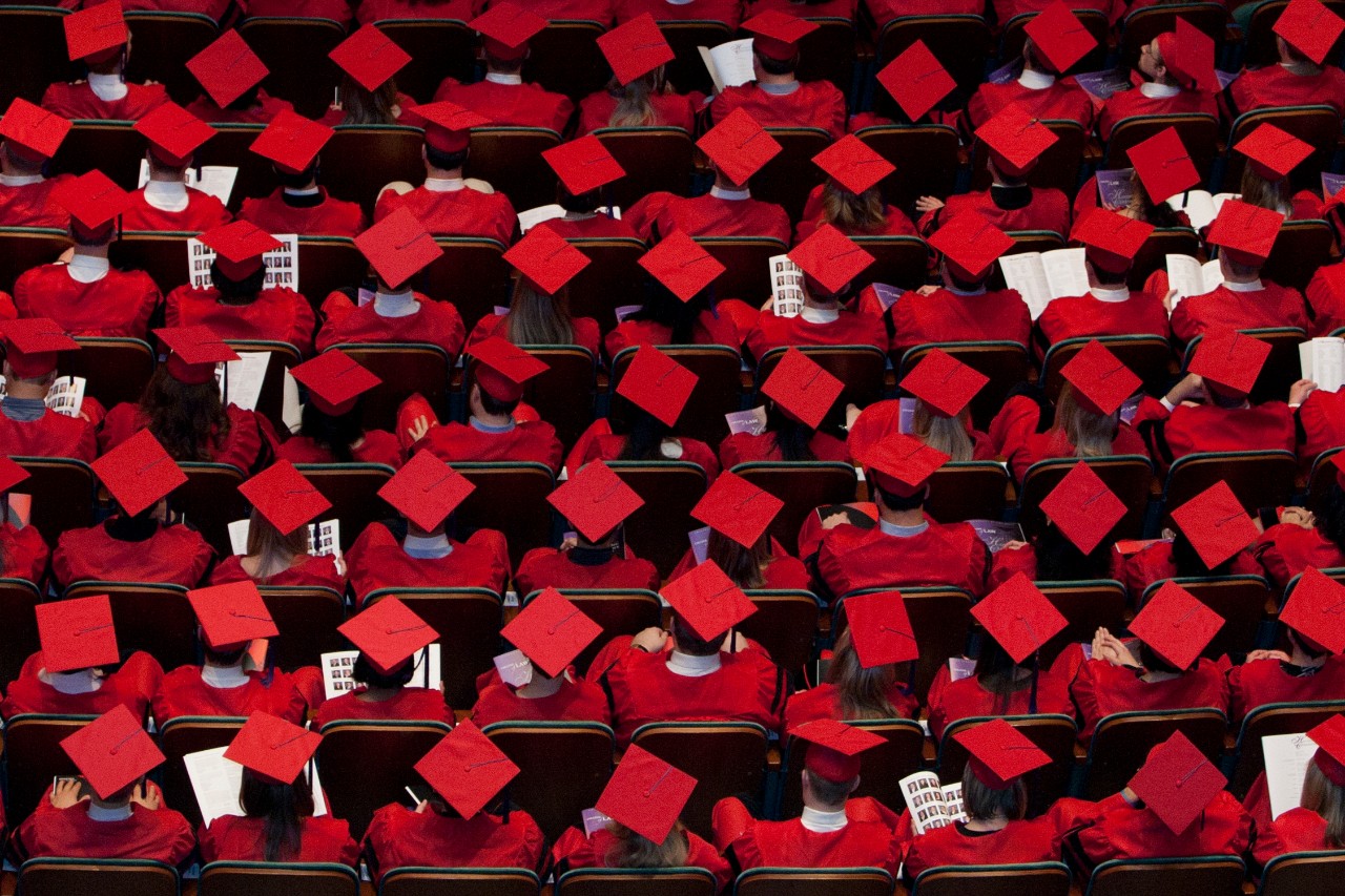 Ariel view of grads wearing red caps