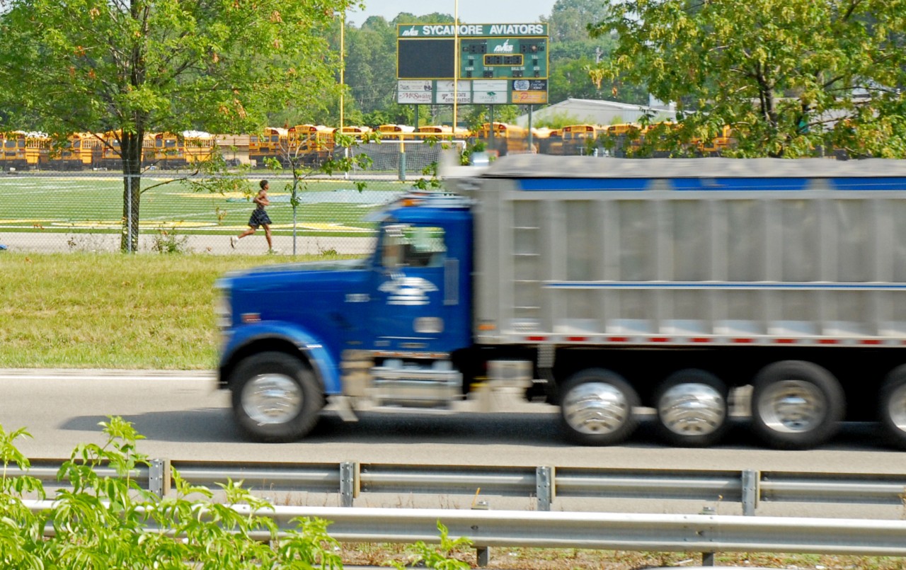 truck passing schoolbuses