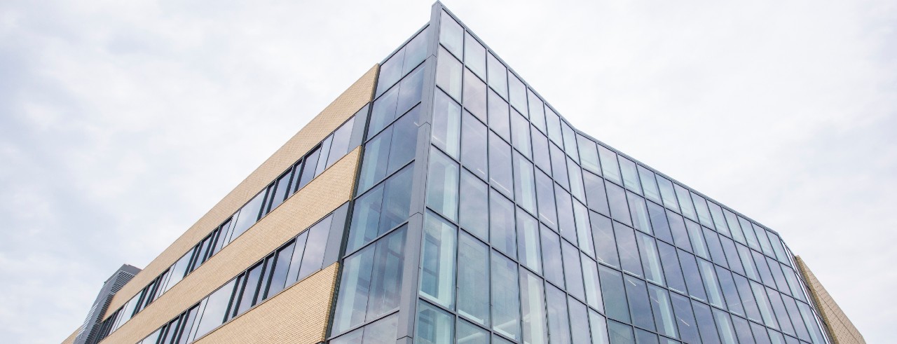 Exterior shot of a glass and brick building, the 1819 Innovation Hub