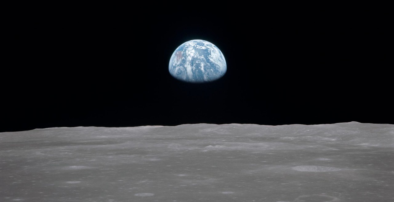 The Earth rises over the moon as viewed from the Apollo 11 spacecraft.