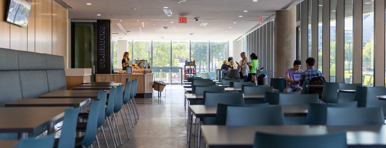 Interior shot of tables and booths at the new Starbucks