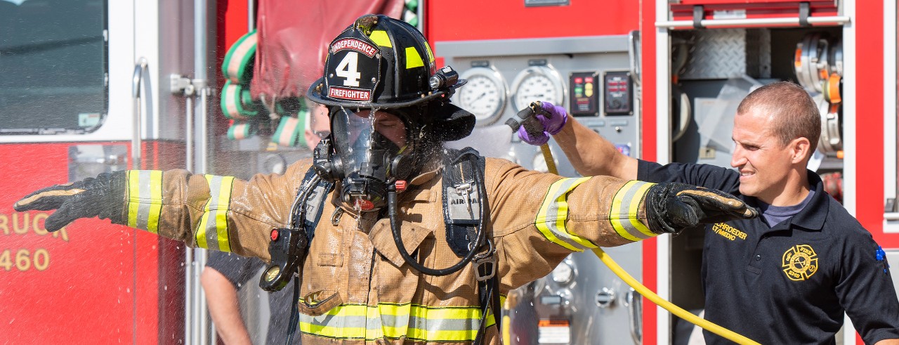 Firefighters demonstrate decontamination