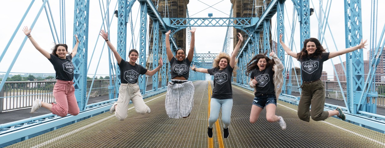 Young women jump on Cincinnati's Roebling Suspension Bridge