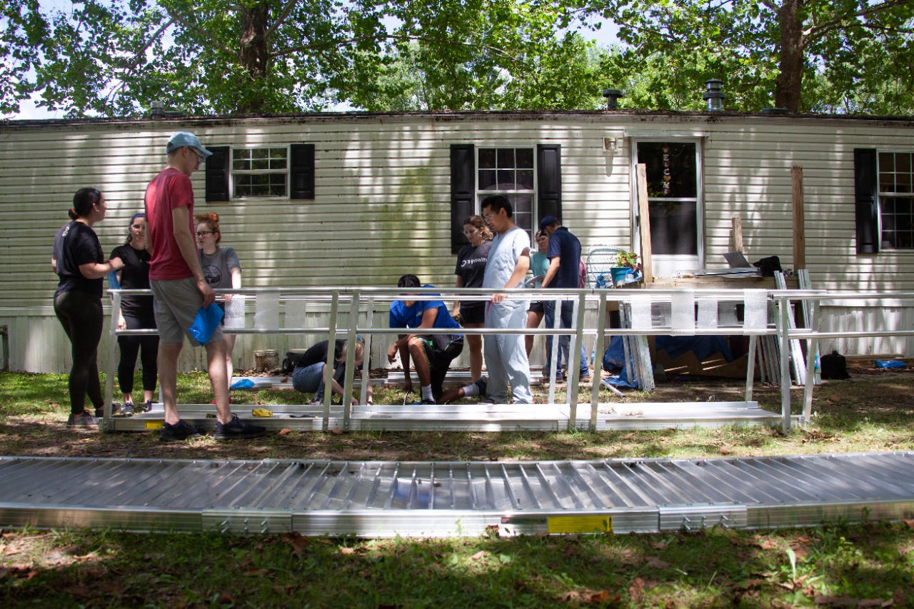 UC medical students build an accessibility ramp for a Northern Kentucky resident.