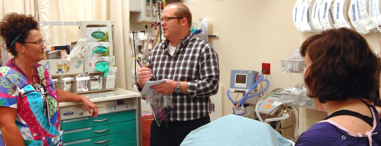 Gordon Gillespie of the UC College of Nursing in a hospital training session with two trainees