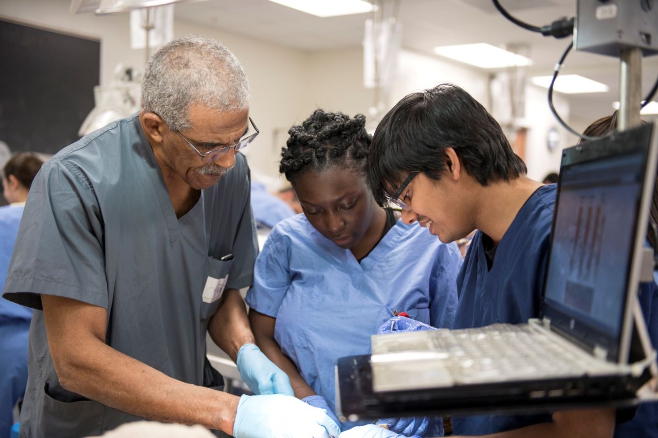 Alvin Crawford, MD, with students in the anatomy lab