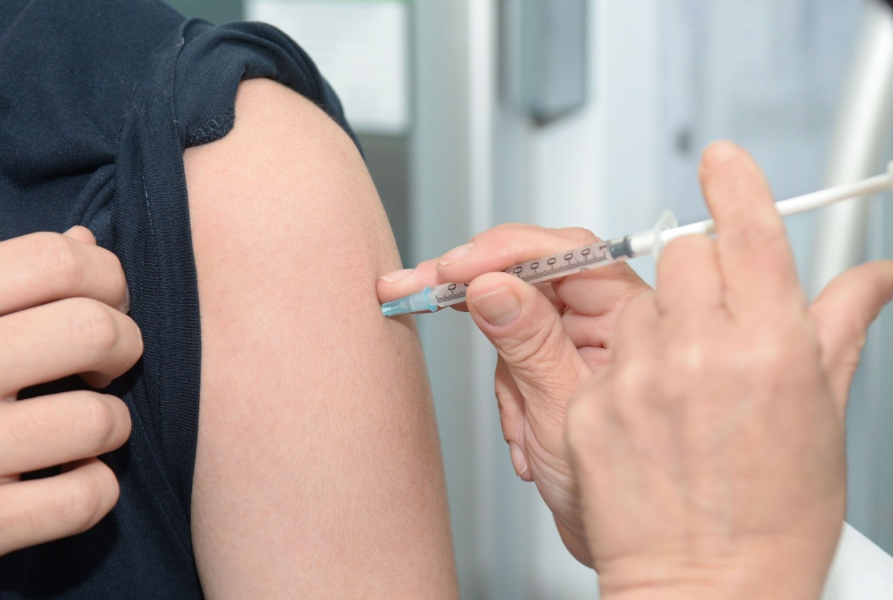 photo of a flu vaccine injected into an arm