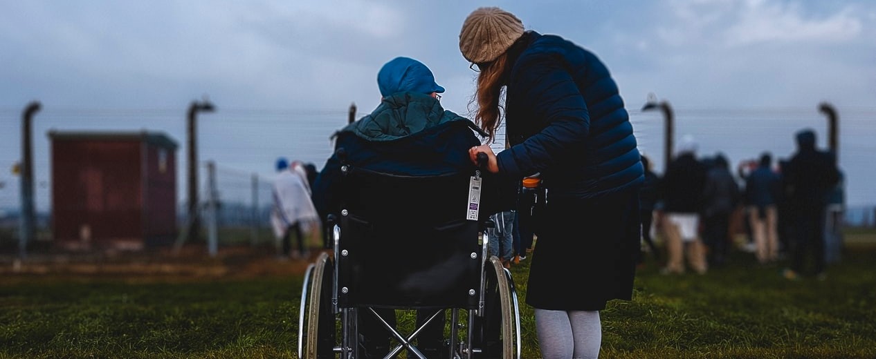 caregiver with patient in wheelchair