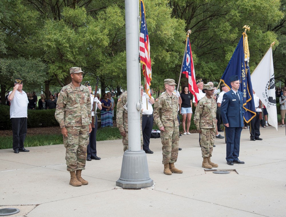 Veteran students stand at attention during the Sept. 11 ceremony on the UC Blue ASh Campus