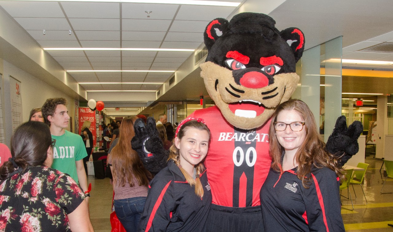 Bearcat mascot with UC Blue Ash College students at open house event