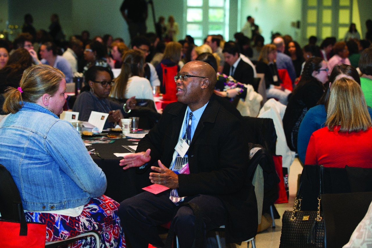 Participants at UC's Equity and Inclusion Conference interact during a session.