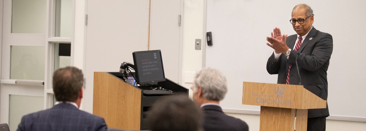 Image of President Neville Pinto applauding at the All-University Faculty Meeting on Oct. 31, 2019, in Room 400, TUC.