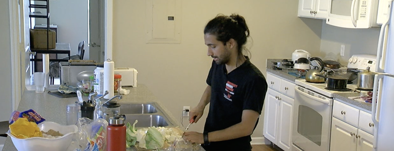 UC student from Nepal cooks in his kitchen